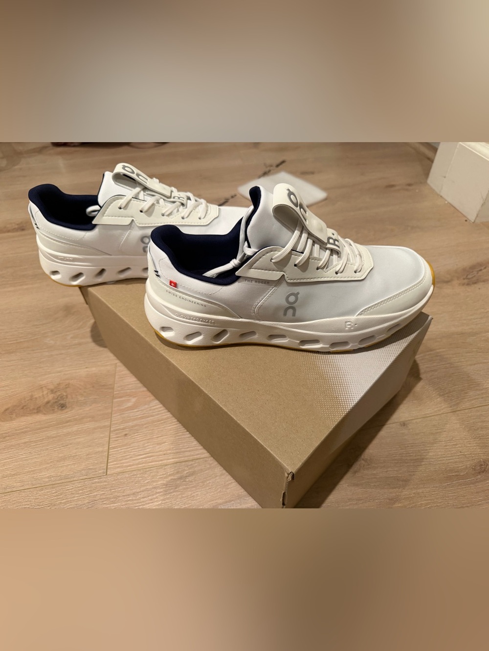 On Running women’s White Sneakers with Navy Accents